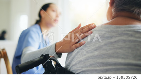 Woman, hand and nurse with patient in wheelchair for elderly care, support or trust at old age home. Closeup of medical doctor or caregiver listening to person with a disability for health advice 139305720