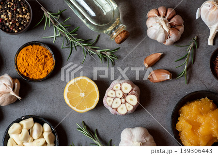 Assorted Spices and Fresh Ingredients on Gray Surface Assorted Spices and Fresh Ingredients on Gray Surface 139306443