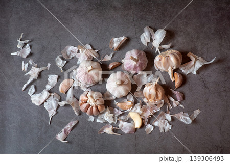 Fresh Garlic Bulbs and Cloves on Dark Surface Fresh Garlic Bulbs and Cloves on Dark Surface 139306493