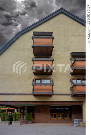 Residential building with balconies on stormy sky background Residential building with balconies on stormy sky background 139308517