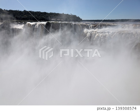 Iguazu Falls in a mist of spray at Iguazu National Park and Reserve in Argentina in June. Close-up 139308574
