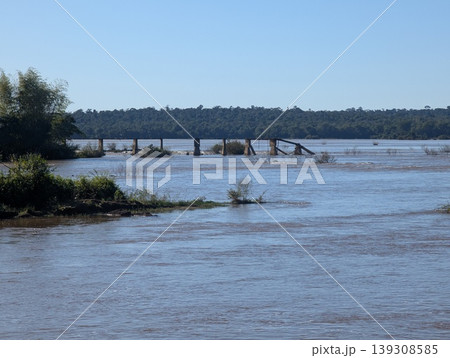 A view of the Iguazu River and tourist platforms in the sun at Iguazu National Park and Reserve in Argentina in June A view of the Iguazu River and tourist platforms in the sun at Iguazu National Park and Reserve in Argentina in June 139308585