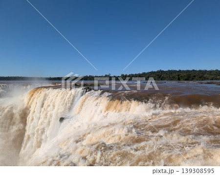 A close-up of the Iguazu River's waters cascading into a waterfall in Iguazu National Park and Reserve in Argentina, June 139308595