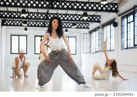 Asian woman studying movement of contemporary dance Asian woman studying movement of contemporary dance 139309492