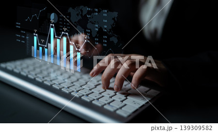 Business Person Analyzing Data on Keyboard with Digital Charts and Graphs Displaying Global Trends in Financial Analysis and Market Research Scalp 139309582