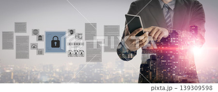 Businessman Using Smartphone in Cityscape Background with Digital Security Concepts and Data Privacy Symbols, Emphasizing Cybersecurity in Modern Technology Gantry 139309598