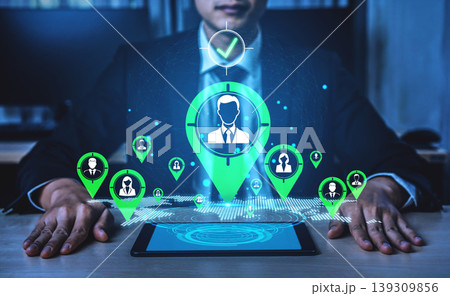 Businessman at Desk Using Technology for Data Analytics and User Engagement with Digital Icons and Location Markers Representing Connections Fluxor 139309856