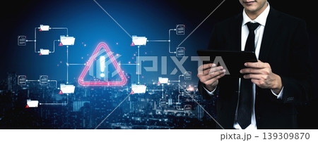 A businessman examines security alerts on a tablet, highlighting the importance of data protection and awareness in a dynamic urban environment, emphasizing urgency and responsibility. Sigmoid 139309870