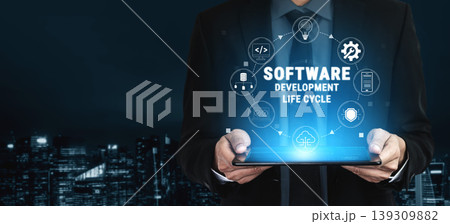 Businessman Holding Tablet Displaying Software Development Life Cycle with Digital Icons Illustrating Modern Technology Concepts Quark Businessman Holding Tablet Displaying Software Development Life Cycle with Digital Icons Illustrating Modern Technology Concepts Quark 139309882