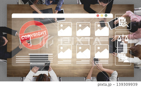 Modern Business Meeting with Technology, Copyright Illustration on Table, Diverse Group Collaborating on Digital Strategy, Overhead View, Work Environment Ledger 139309939