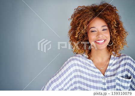 Portrait, happy and creative business woman isolated on a gray background in company office. Confident face, professional smile and designer, entrepreneur or young worker at startup in South Africa Portrait, happy and creative business woman isolated on a gray background in company office. Confident face, professional smile and designer, entrepreneur or young worker at startup in South Africa 139310079