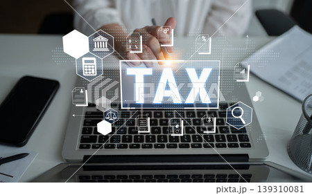 Person Working on Laptop with Tax Iconography and Digital Graphics, Focusing on Finances, Accounting, and Tax Preparation Concepts Fluxor Person Working on Laptop with Tax Iconography and Digital Graphics, Focusing on Finances, Accounting, and Tax Preparation Concepts Fluxor 139310081