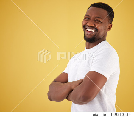 Man, portrait and smile in studio on yellow background, confidence or mockup space. Black person, model and happy face in positive mood for relax decision or deal information, yes news or show offer 139310139