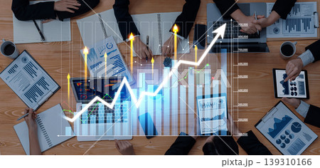 Business Meeting with Data Analysis and Growth Charts on Table, Team Collaboration and Strategic Planning in Modern Workspace Environment Scalp 139310166