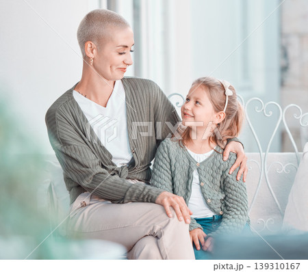 Mom, girl and hug with smile in home living room with care, love and bonding with conversation. Family house, mother and daughter child with embrace, happy and thinking with memory at apartment Mom, girl and hug with smile in home living room with care, love and bonding with conversation. Family house, mother and daughter child with embrace, happy and thinking with memory at apartment 139310167