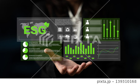 Business professional analyzing ESG data metrics with graphics on digital screen focusing on sustainability, governance, social responsibility, and performance indicators Gantry Business professional analyzing ESG data metrics with graphics on digital screen focusing on sustainability, governance, social responsibility, and performance indicators Gantry 139310168