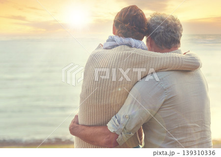 Old couple, hug and sunset on sea at the beach with care, support and trust in marriage or retirement. Back, man and woman in embrace with love, kindness and gratitude for vacation or holiday Old couple, hug and sunset on sea at the beach with care, support and trust in marriage or retirement. Back, man and woman in embrace with love, kindness and gratitude for vacation or holiday 139310336