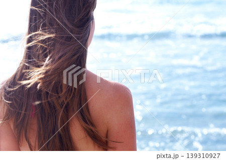 Beach, summer and back of thinking woman by ocean for holiday, vacation and relaxing in nature. Travel mockup, tropical island and person with scenic view for adventure, freedom and swimming in sea 139310927