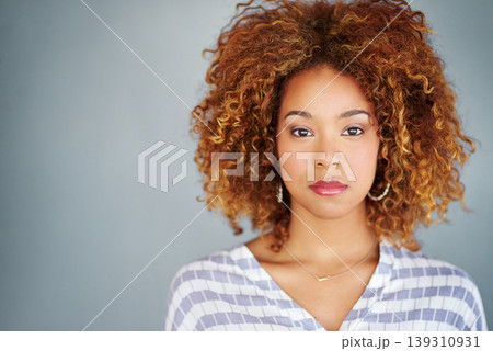 Portrait, serious and creative business woman isolated on a gray background mockup space. Confident face, professional and designer, entrepreneur or young worker at startup office in South Africa 139310931