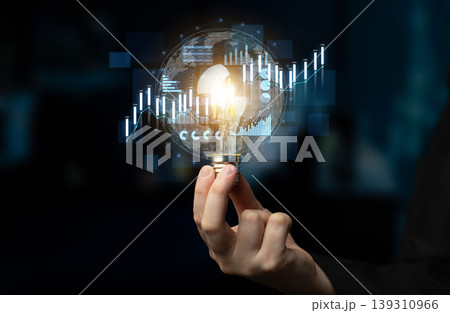 Hand Holding Light Bulb with Graph Overlay Representing Innovation, Ideas, Data Analysis, Technology, Business Concepts, and Modern Growth Strategies Scalp Hand Holding Light Bulb with Graph Overlay Representing Innovation, Ideas, Data Analysis, Technology, Business Concepts, and Modern Growth Strategies Scalp 139310966