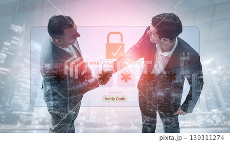 Two business professionals engage in a handshake, showcasing collaboration. A digital security overlay symbolizes trust and technology in the modern corporate environment. Sigmoid 139311274