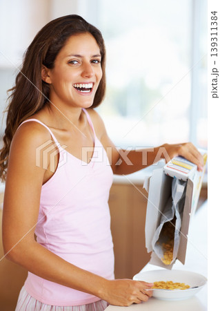 Breakfast, cereal and portrait of woman in kitchen for healthy eating, diet and nutrition at home. Food, morning and person smile with bowl of porridge for health, vitamins and wellness to start day 139311384