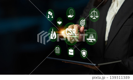 Business Professional Demonstrating Corporate Social Responsibility Insights with Digital Icons and Technology Interface for Modern Enterprises Fluxor 139311389