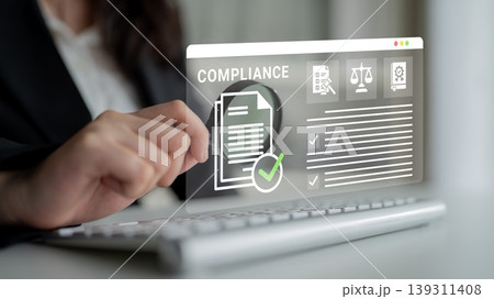 Business Professional Engaging with Digital Compliance Interface Using Modern Technology in a Corporate Environment Ledger Business Professional Engaging with Digital Compliance Interface Using Modern Technology in a Corporate Environment Ledger 139311408