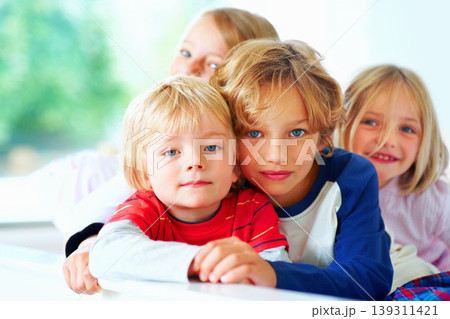Portrait, bed or children with brother and sister siblings in their home together to relax. Family, love or bonding with cute boy and girl kids in the bedroom of their apartment on the weekend 139311421