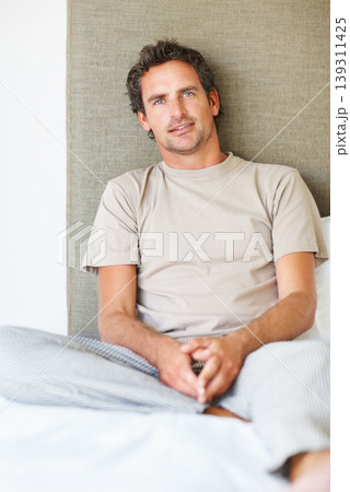 Portrait, mature man and relax bed in the morning after nap, break and awake from comfortable sleep at home. Happy guy wake up in bedroom for healthy rest, routine or cozy day in pajamas in apartment Portrait, mature man and relax bed in the morning after nap, break and awake from comfortable sleep at home. Happy guy wake up in bedroom for healthy rest, routine or cozy day in pajamas in apartment 139311425