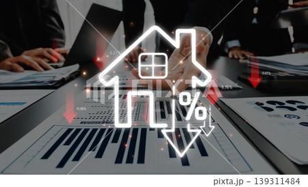 Business professionals collaborate on real estate market trends, exploring charts that indicate a decline in property values and its potential effect on investments. Sigmoid 139311484
