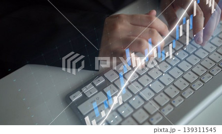 Professional hands typing on a keyboard with digital graphs and charts, representing technology, finance, and data analytics in a modern workspace. Copula Professional hands typing on a keyboard with digital graphs and charts, representing technology, finance, and data analytics in a modern workspace. Copula 139311545