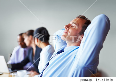 Hands, head and business man relax in office or chair to finish work, project and productivity. Corporate worker, team and happy person resting, smile and calm in meeting for break, peace and tired Hands, head and business man relax in office or chair to finish work, project and productivity. Corporate worker, team and happy person resting, smile and calm in meeting for break, peace and tired 139311616
