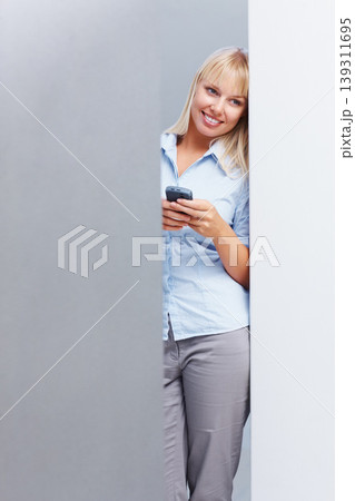 Businesswoman, thinking and smartphone in studio for corporate career with technology in mockup. Young person, idea and cellphone as professional consultant with online website with gray background Businesswoman, thinking and smartphone in studio for corporate career with technology in mockup. Young person, idea and cellphone as professional consultant with online website with gray background 139311695