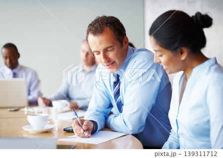 Business people, writing and brainstorming in meeting with manager advice, feedback and teamwork on paper. Professional executive, boss and woman with ideas, financial planning or collaboration notes Business people, writing and brainstorming in meeting with manager advice, feedback and teamwork on paper. Professional executive, boss and woman with ideas, financial planning or collaboration notes 139311712