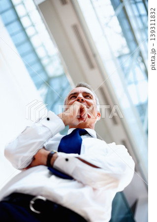 Businessman, thinking and low angle with idea for future, planning and success. Corporate, person or manager with smile in excitement of vision in modern office with formal fashion for profession Businessman, thinking and low angle with idea for future, planning and success. Corporate, person or manager with smile in excitement of vision in modern office with formal fashion for profession 139311832
