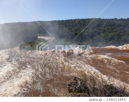 Aerial view of the water and rocks at Devil's Throat Falls in Iguazu National Park and Reserve in Argentina in June. Close-up Aerial view of the water and rocks at Devil's Throat Falls in Iguazu National Park and Reserve in Argentina in June. Close-up 139311955