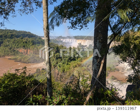 A panoramic view of the rainbow and Iguazu Falls in Iguazu National Park and Reserve in Argentina, June A panoramic view of the rainbow and Iguazu Falls in Iguazu National Park and Reserve in Argentina, June 139311967
