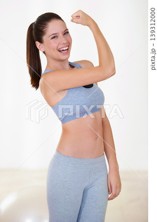 Woman, portrait or happy in studio with flex for fitness, wellness or workout strength with sportswear. Person, athlete or laugh for biceps, exercise and training on white background or mock up space Woman, portrait or happy in studio with flex for fitness, wellness or workout strength with sportswear. Person, athlete or laugh for biceps, exercise and training on white background or mock up space 139312000