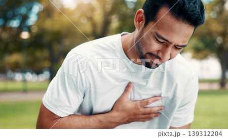 Fitness, man and exhausted in park with chest pain, respiratory problem or hurt from intense exercise. Active, person and breathing issue outdoor with fatigue, sports injury or heart attack symptoms. Fitness, man and exhausted in park with chest pain, respiratory problem or hurt from intense exercise. Active, person and breathing issue outdoor with fatigue, sports injury or heart attack symptoms. 139312204