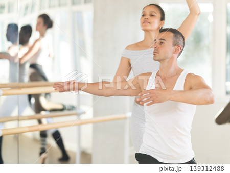 Young man and young woman rehearsing pair ballet 139312488