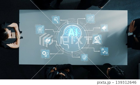 A diverse business team collaborates around a futuristic table showcasing an AI brain icon, discussing innovative strategies in technology-driven environments. Sigmoid 139312646
