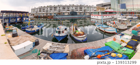Fishing boats moored in harbor with submarine in Genoa Italy Fishing boats moored in harbor with submarine in Genoa Italy 139313299
