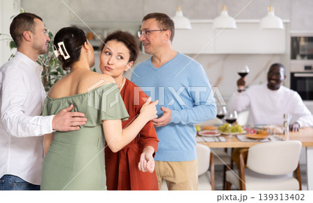 Group of friends greeting each other 139313402