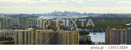 Expensive highrise hotels and condos on Atlantic ocean shore in Sunny Isles Beach city. American tourism infrastructure in southern Florida Expensive highrise hotels and condos on Atlantic ocean shore in Sunny Isles Beach city. American tourism infrastructure in southern Florida 139313884