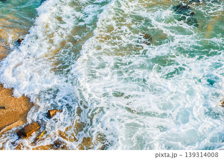 Sea tidal waves with white foam on galle sea bath beach 139314008