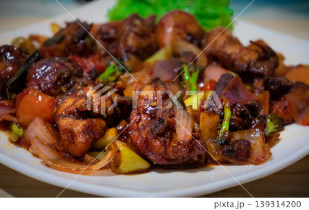Sri Lanka Devilled Chicken cuisine dish side view Sri Lanka Devilled Chicken cuisine dish side view 139314200