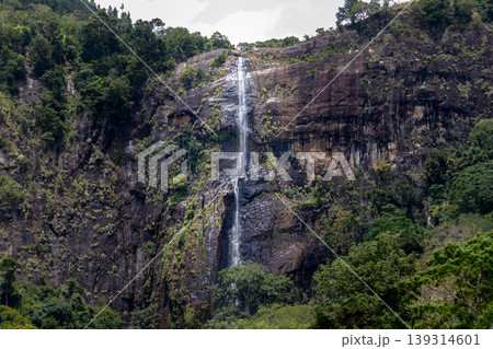 Diyaluma falls almost dried out, dry season in koslanda, from a long-distance photograph. Diyaluma falls almost dried out, dry season in koslanda, from a long-distance photograph. 139314601