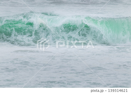 Tides crashing and splashing nice clear blue water in the Indian ocean. 139314621