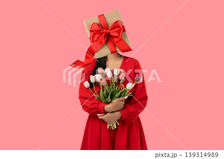 Woman with gift instead head holding bouquet Woman with gift instead head holding bouquet 139314989